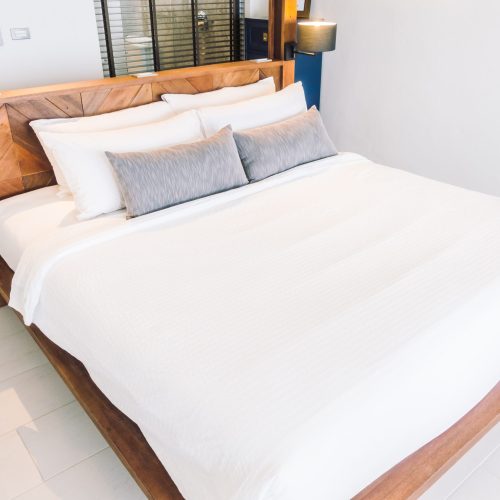 White pillow on bed Beautiful luxury white pillow on bed decoration in bedroom interior - Vintage Light Filter